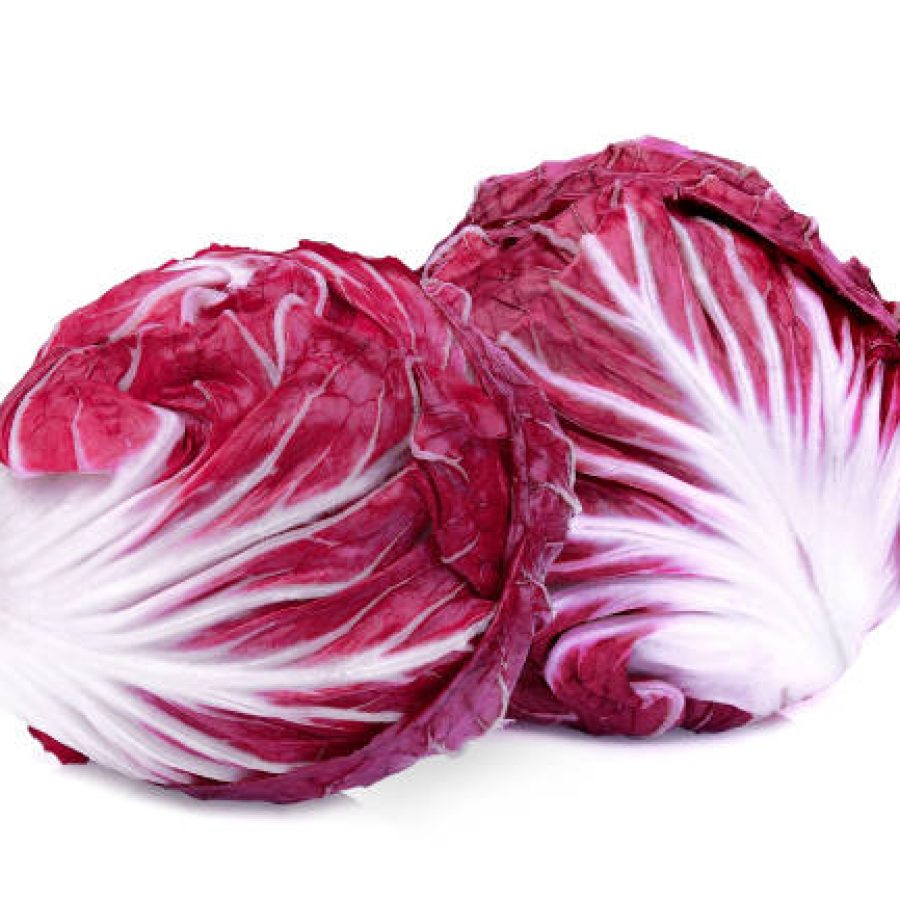 two whole red radicchio or red salad isolated on white background