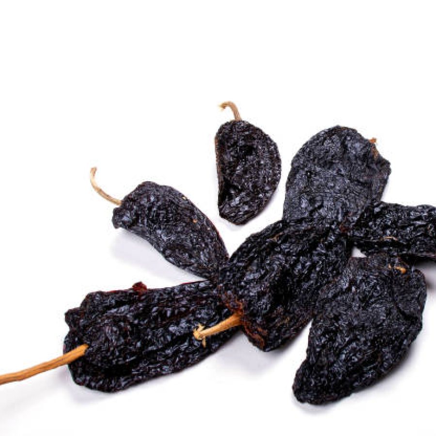 Ancho Chile and Mulato Chile or Dried Poblano Chile Peppers. Mexican Traditional Food.