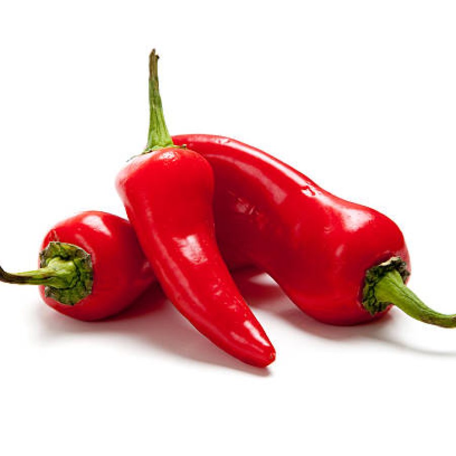 A group of hot red peppers or fresno peppers on white background
